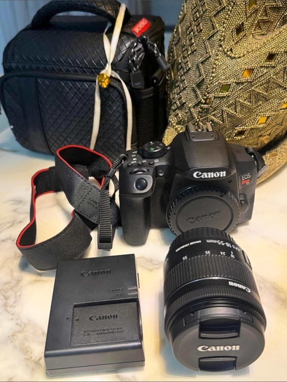 Canon EOS Rebel T8i Camera Kit in Black with Red-Trim Strap